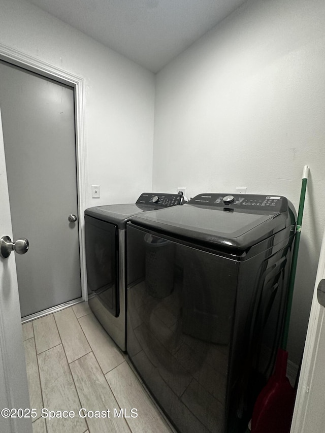 laundry room with washing machine and dryer