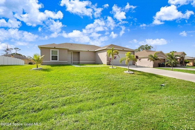 single story home with a front lawn and a garage