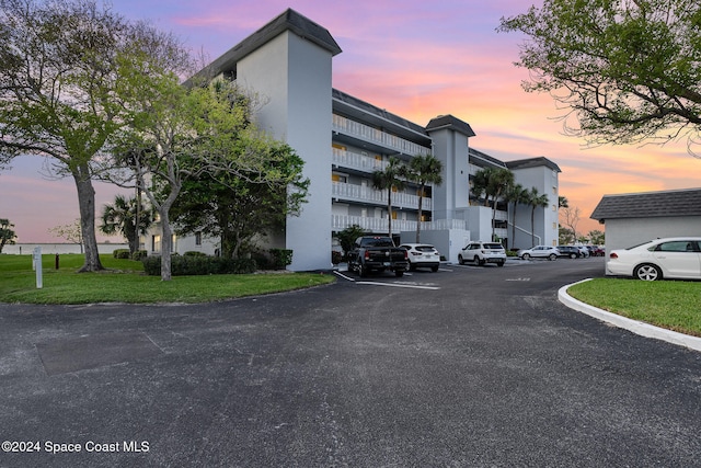 view of outdoor building at dusk