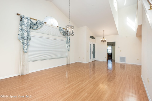 interior space with hardwood / wood-style floors and high vaulted ceiling