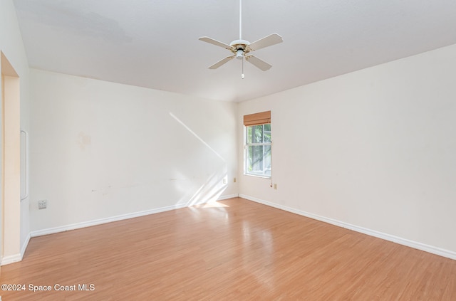 empty room with light wood-type flooring and ceiling fan