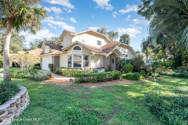 view of front of property with a garage and a front lawn