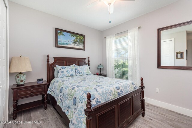 bedroom featuring light hardwood / wood-style floors and ceiling fan