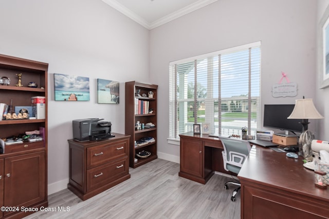 office space featuring light wood-type flooring and ornamental molding