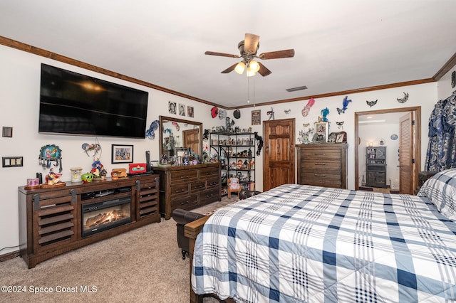 bedroom with light carpet, crown molding, and ceiling fan