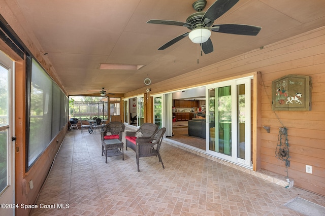 sunroom / solarium with ceiling fan