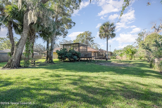 view of yard featuring a sunroom