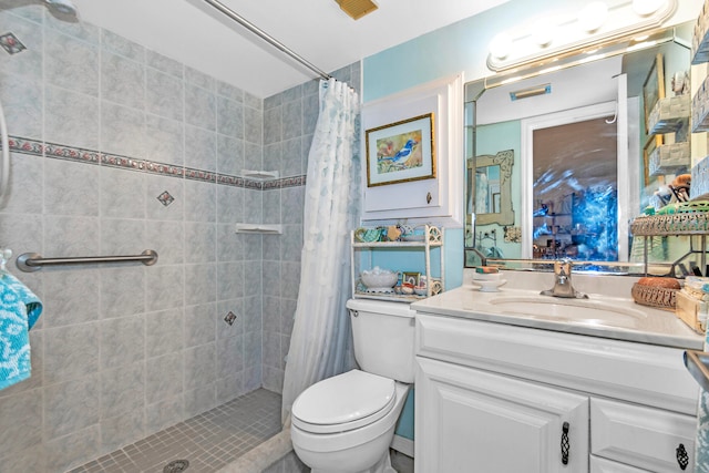 bathroom with vanity, toilet, and a shower with shower curtain