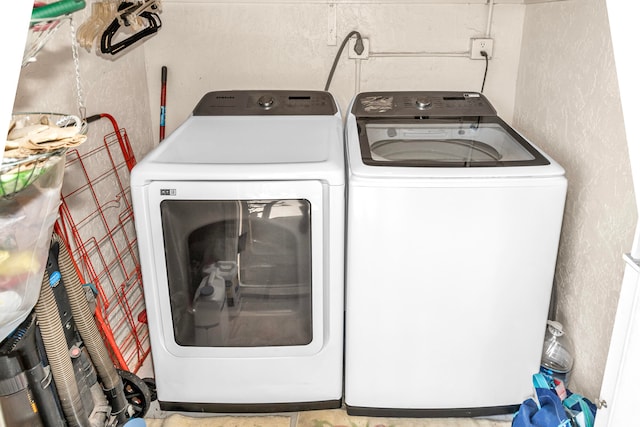 laundry room featuring separate washer and dryer