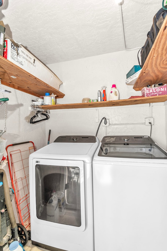 washroom featuring washer and dryer