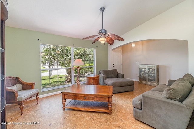 living room with ceiling fan and lofted ceiling