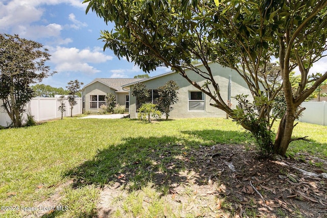 exterior space with a front lawn