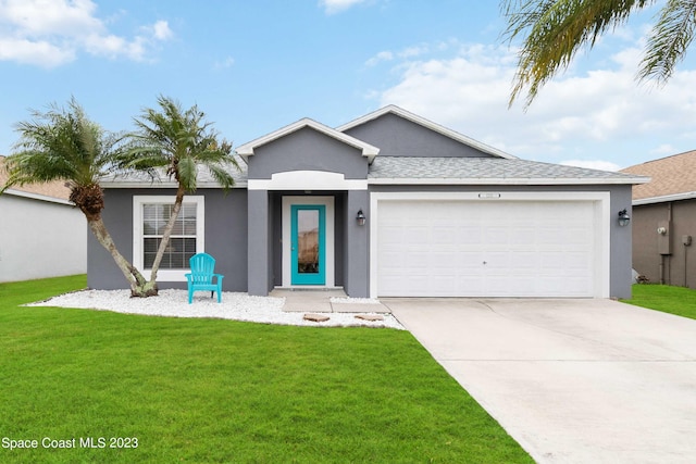 ranch-style house featuring a garage and a front yard