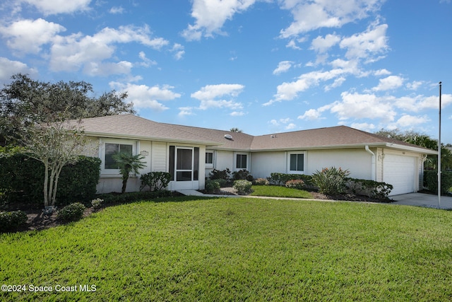 ranch-style home with a garage and a front yard