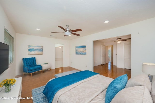 bedroom featuring hardwood / wood-style floors and ceiling fan