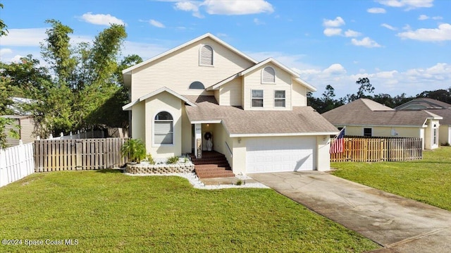 front of property with a garage and a front yard