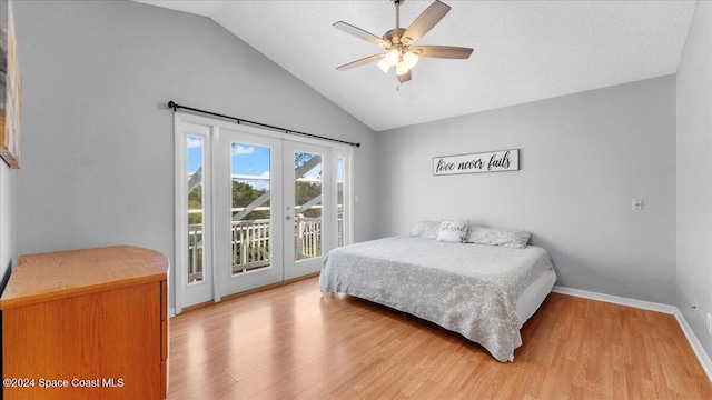 bedroom with access to outside, vaulted ceiling, ceiling fan, and wood-type flooring