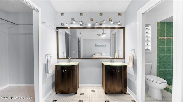 bathroom featuring vanity, ceiling fan, tile patterned floors, and toilet