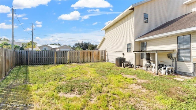 view of yard featuring central air condition unit