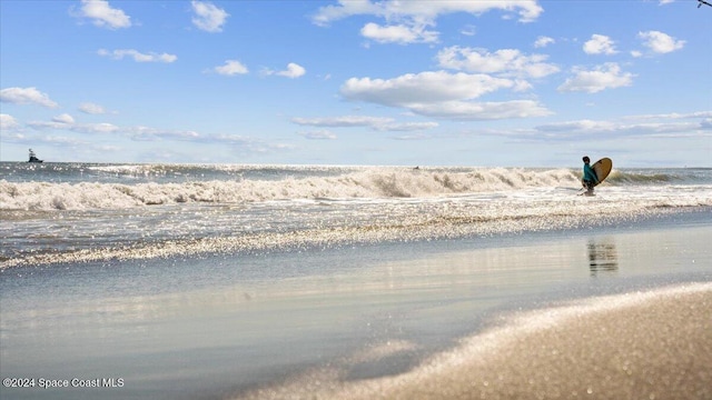 property view of water featuring a beach view