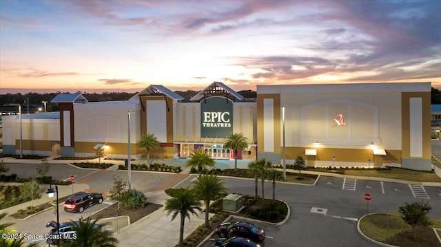 view of outdoor building at dusk