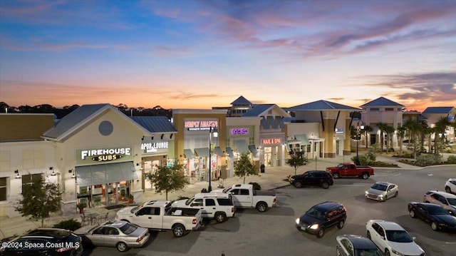 view of outdoor building at dusk