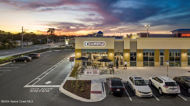 view of outdoor building at dusk