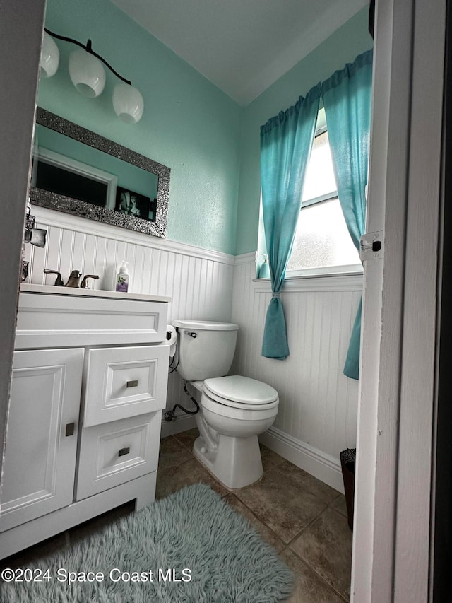 bathroom featuring tile patterned floors and toilet