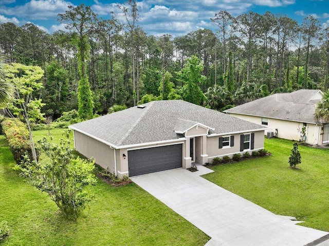 single story home featuring a front lawn, central air condition unit, and a garage