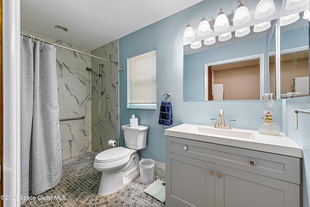 bathroom with tile patterned flooring, vanity, curtained shower, and toilet