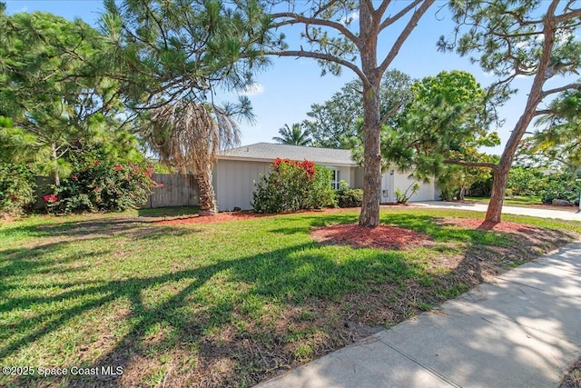 560 Rio Ln, Indialantic, FL 32903 - view of front of home with a garage and concrete driveway