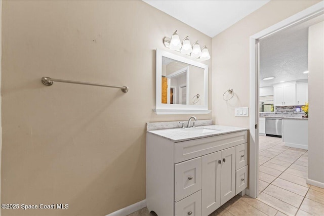 560 Rio Ln, Indialantic, FL 32903 - bathroom featuring vanity, decorative backsplash, tile patterned floors, and baseboards