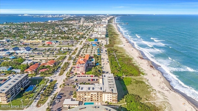 aerial view featuring a water view and a beach view