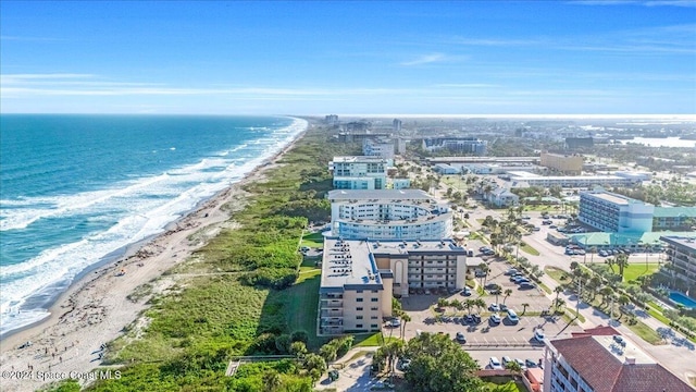 aerial view featuring a water view and a beach view