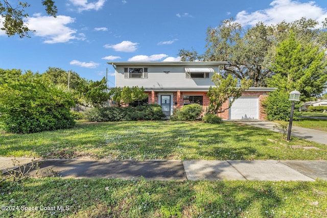 front of property with a garage and a front yard