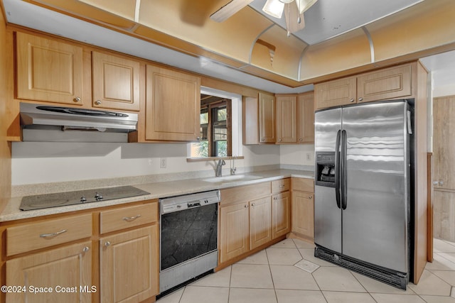 kitchen featuring light brown cabinets, stainless steel appliances, sink, and light tile patterned floors