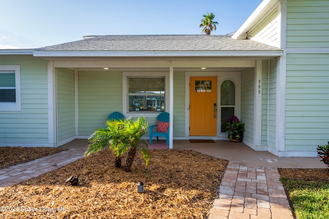 doorway to property featuring covered porch