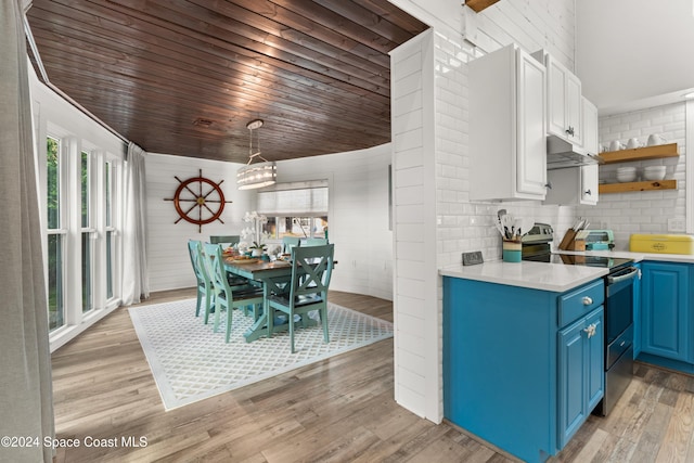 kitchen featuring white cabinets, blue cabinets, hanging light fixtures, light hardwood / wood-style flooring, and stainless steel electric range oven