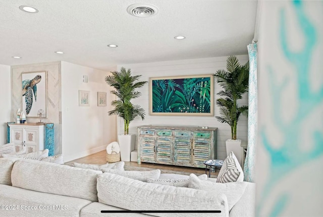 living room with a textured ceiling