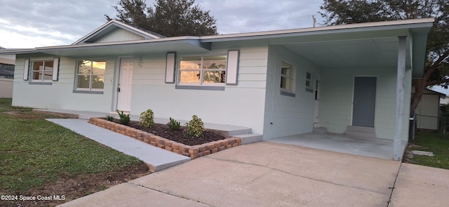 ranch-style house with a carport