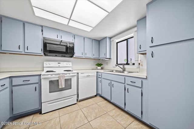 5800 N Banana River Blvd Unit 134, Cape Canaveral, FL 32920 - kitchen with gray cabinetry, a sink, white appliances, light tile patterned flooring, and light countertops
