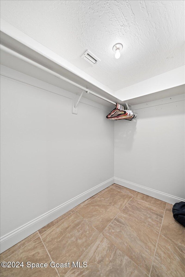 5800 N Banana River Blvd Unit 134, Cape Canaveral, FL 32920 - walk in closet featuring visible vents