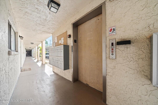 5800 N Banana River Blvd Unit 134, Cape Canaveral, FL 32920 - corridor with elevator and mail area