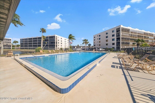 5800 N Banana River Blvd Unit 134, Cape Canaveral, FL 32920 - community pool with a patio area and fence