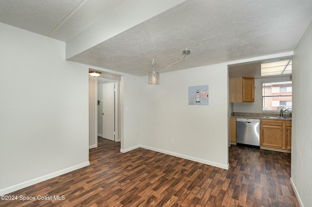 interior space with a textured ceiling, sink, and dark wood-type flooring