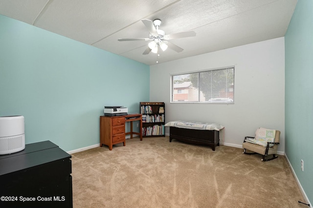 office area with light colored carpet and ceiling fan