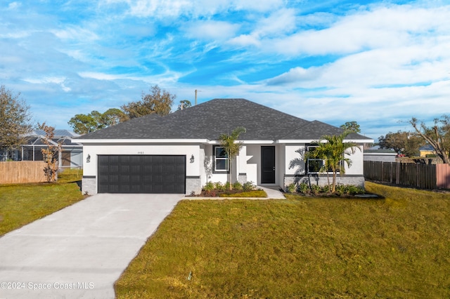 ranch-style home featuring a garage and a front yard