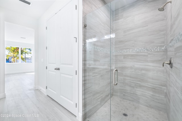 bathroom featuring an enclosed shower