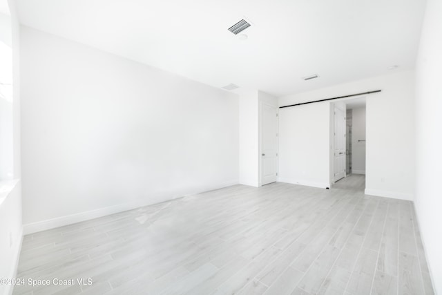 empty room with light wood-type flooring