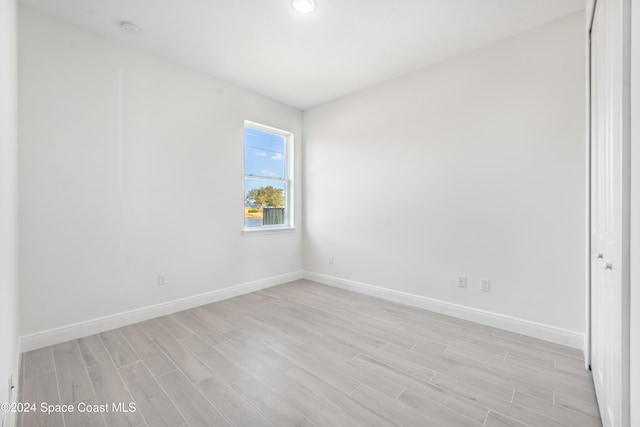 spare room with light wood-type flooring